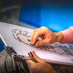 At work — a drawing takes shape in front of the audience.
